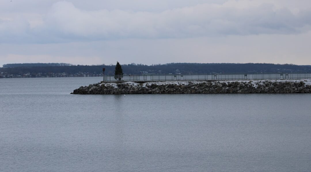 A large body of water with a small island in the middle of it — Geneva: The Finger Lakes' Food and Drink Capital