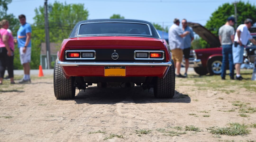A red car parked on top of a dirt road — Canandaigua: The Finger Lakes' Grand Main Street Town