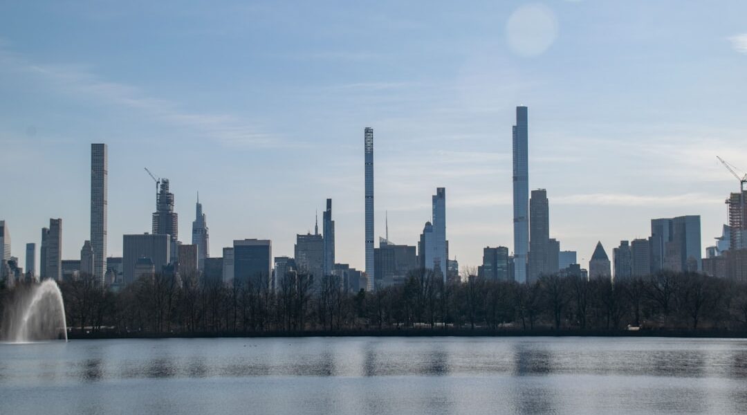 A large body of water with a city in the background — Corning: The Crystal City at the Finger Lakes' Southern Edge
