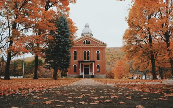 Brown and white concrete building surrounded by trees during daytime — Naples: Grape Pies, Bristol Mountain, and a Gorge Worth the Scramble