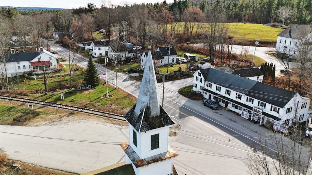 Aerial view of a small town with a church steeple.