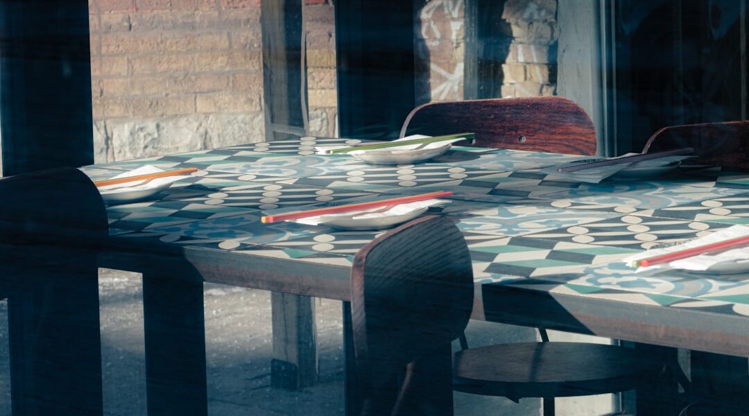 Tables with place settings in a restaurant — Red Newt Bistro