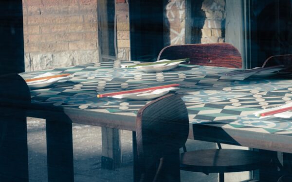 Tables with place settings in a restaurant — Red Newt Bistro