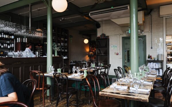 Restaurant interior with tables and bar area. — New York Kitchen