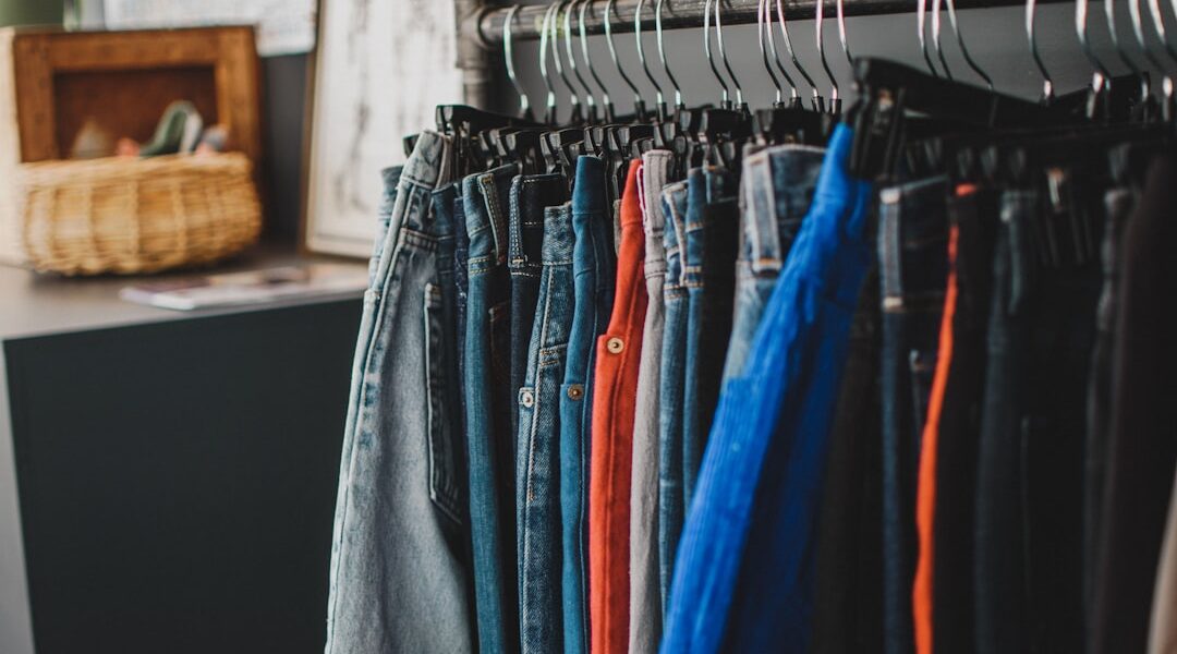 Gray denim jeans on clothes hanger — The Strong National Museum of Play