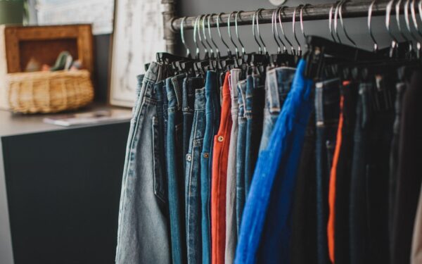 Gray denim jeans on clothes hanger — The Strong National Museum of Play