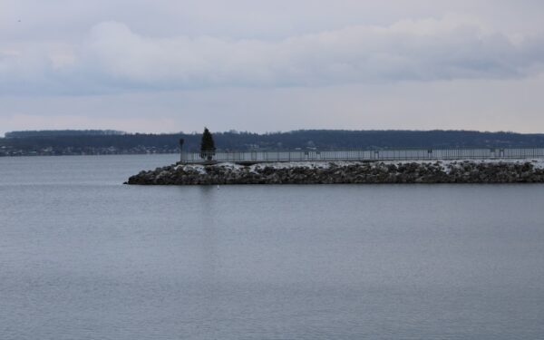 A large body of water with a small island in the middle of it — Best Restaurants in Geneva, NY: A Local Dining Guide