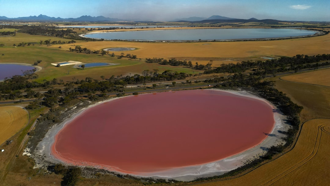 An aerial view of a red lake surrounded by fields — Finger Lakes Farmers Markets: A Weekly Schedule by Town