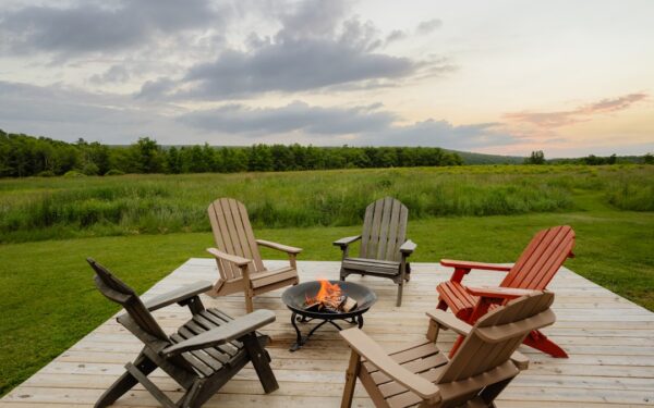 A group of chairs sitting on top of a wooden deck — Finger Lakes on a Budget: Free Hikes, Public Beaches, and $5 Tastings