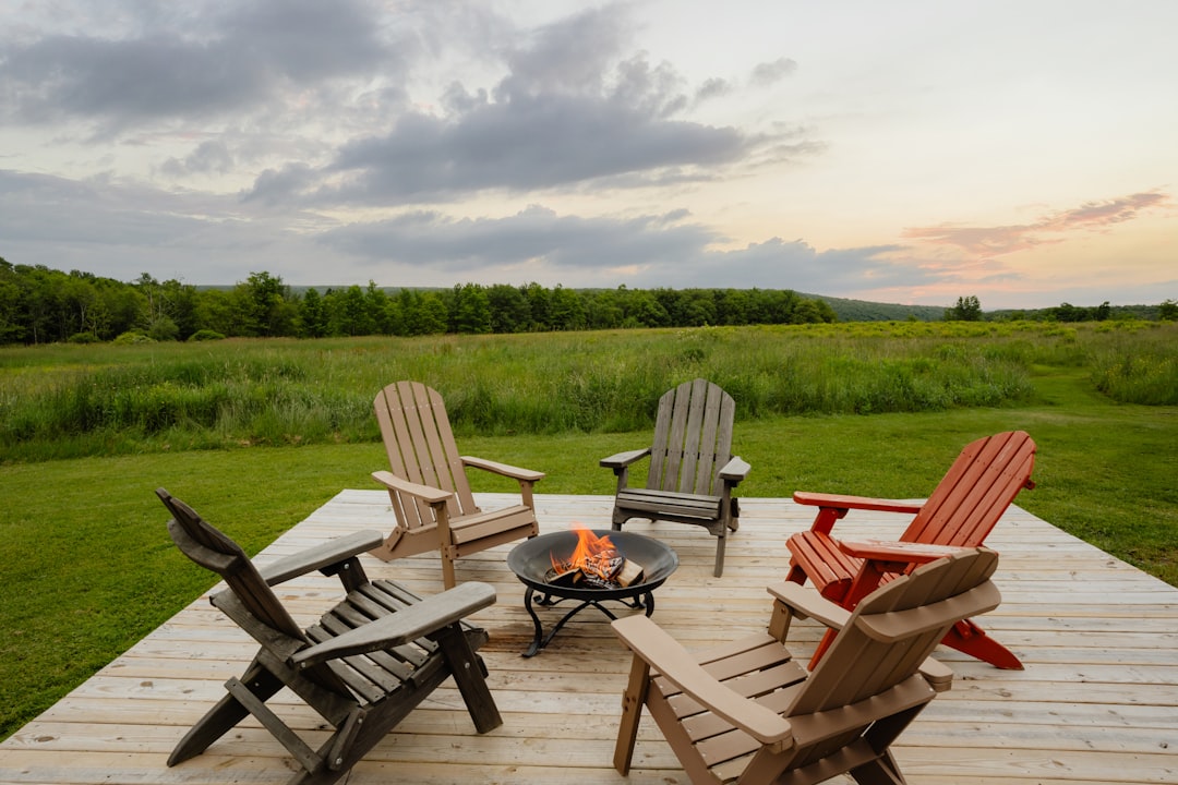 A group of chairs sitting on top of a wooden deck — Finger Lakes on a Budget: Free Hikes, Public Beaches, and $5 Tastings