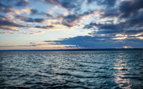 A body of water with a land in the distance — How Deep Is Seneca Lake? (And Other Strange Facts)