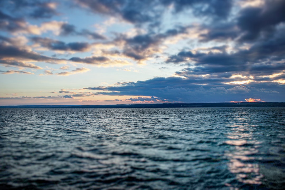 A body of water with a land in the distance — How Deep Is Seneca Lake? (And Other Strange Facts)