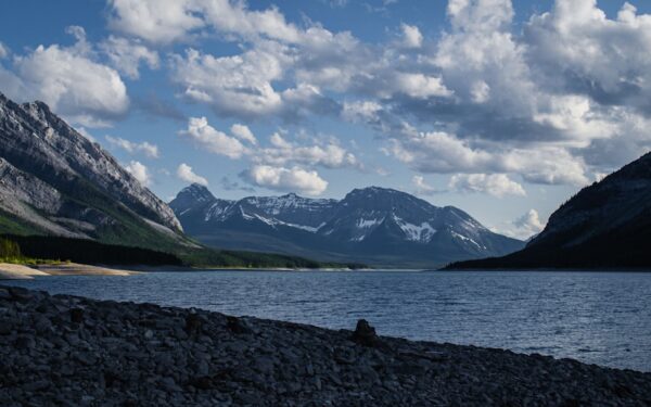 Mountain lake with dramatic clouds and rocky shore — The Best Finger Lakes Breweries (A Local's Picks)