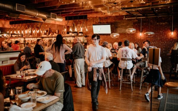 A group of people sitting at tables in a restaurant — The Finger Lakes Beer Trail: 15 Breweries in 3 Days