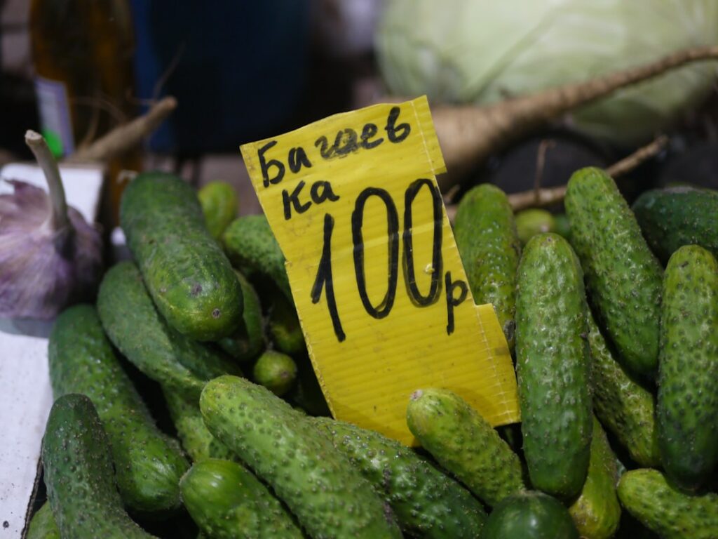 Cucumbers with a price tag at a market.