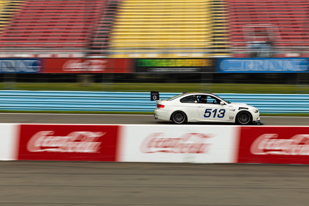 A white car driving down a race track — Watkins Glen State Park Parking: Where to Go When the Lot Is Full