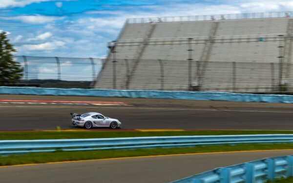 A small car driving down a race track — Watkins Glen vs. Letchworth: Which New York Gorge Is Worth Your Time?